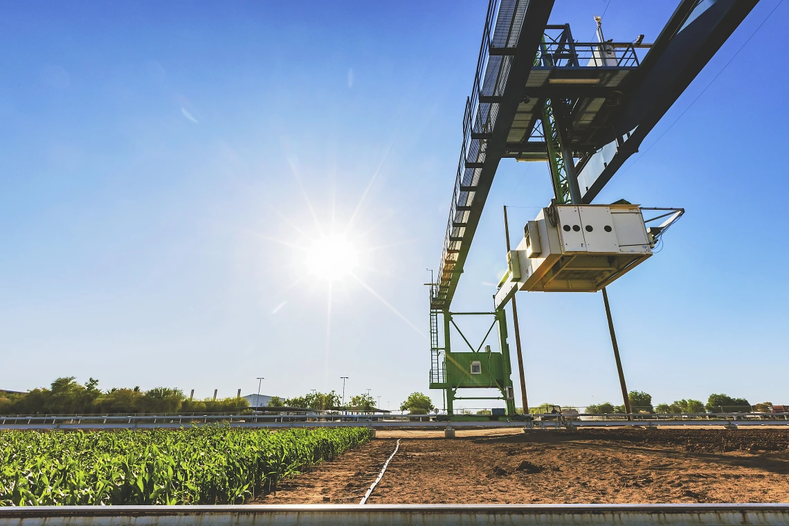 Photo of a robotic scanner over a field of crops