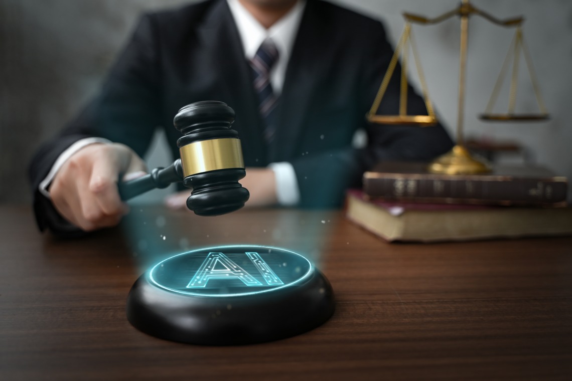 Person holding a gavel about to struck against a circular sound block with an AI symbol 